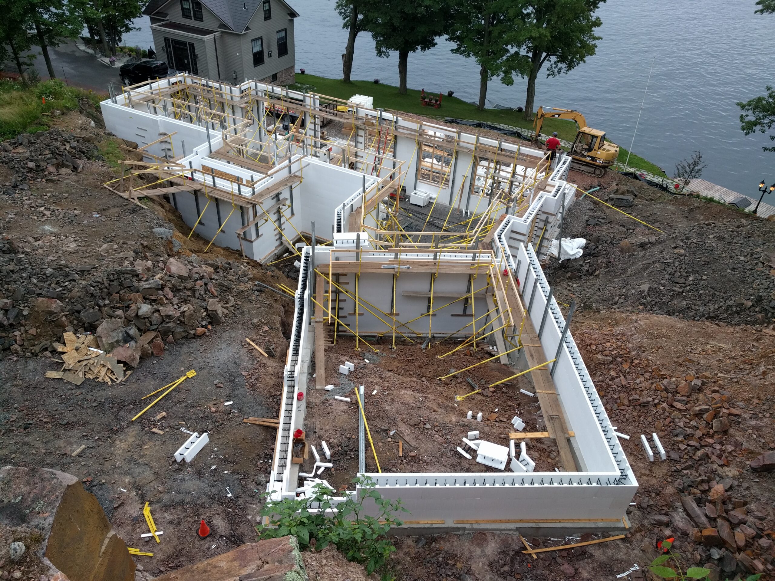 ICF construction on a Kawartha lakeside build — walls going up with lake view